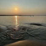 photo of a sunset over peaceful water