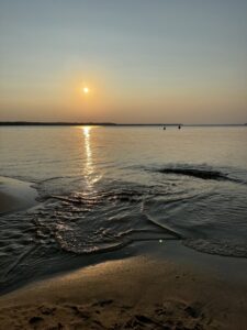 photo of a sunset over peaceful water