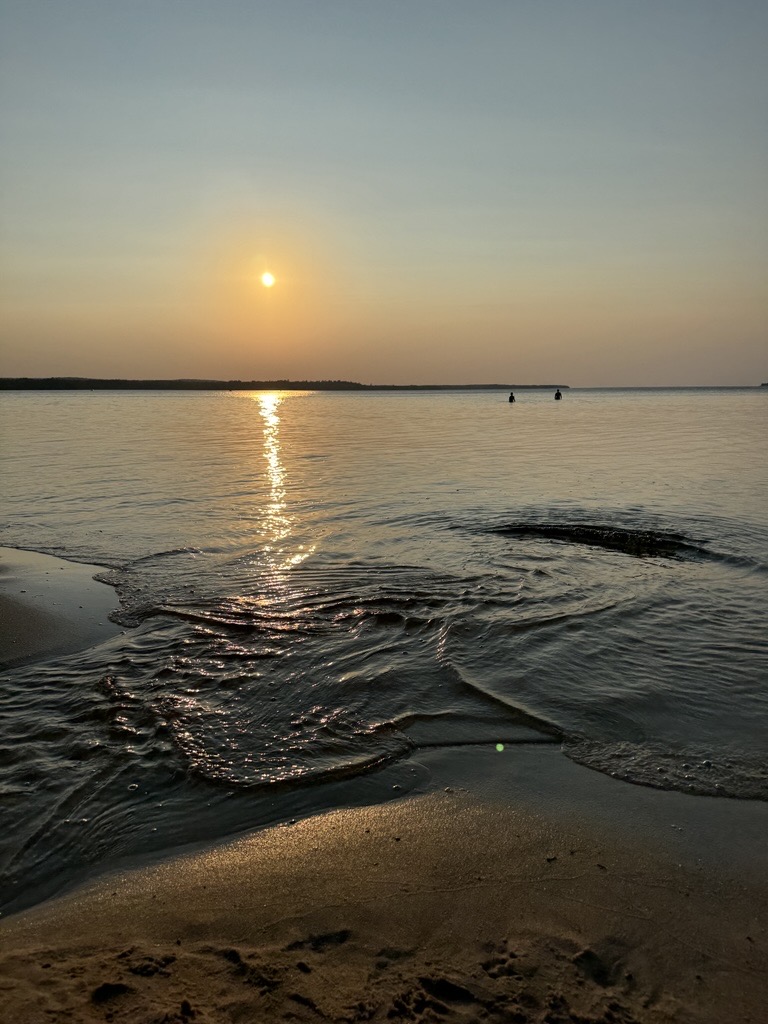 photo of a sunset over peaceful water